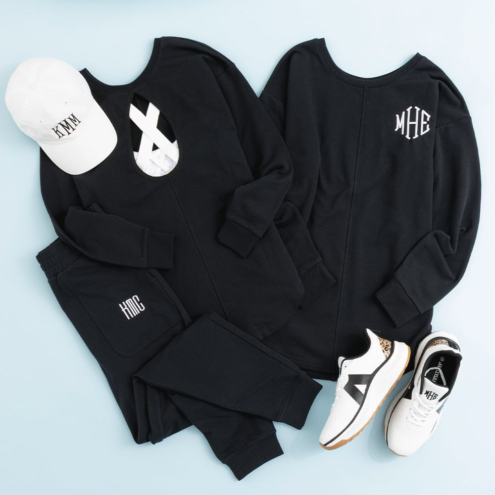 black open back sweatshirt flatlay