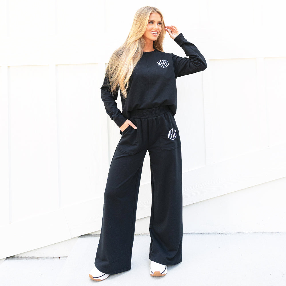 black open back sweatshirt with wide leg pants