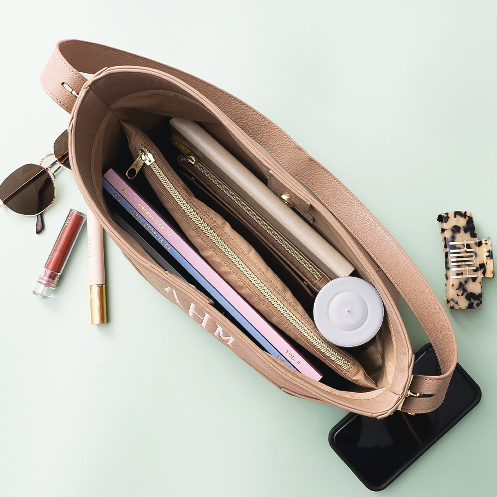 inside of taupe bucket bag
