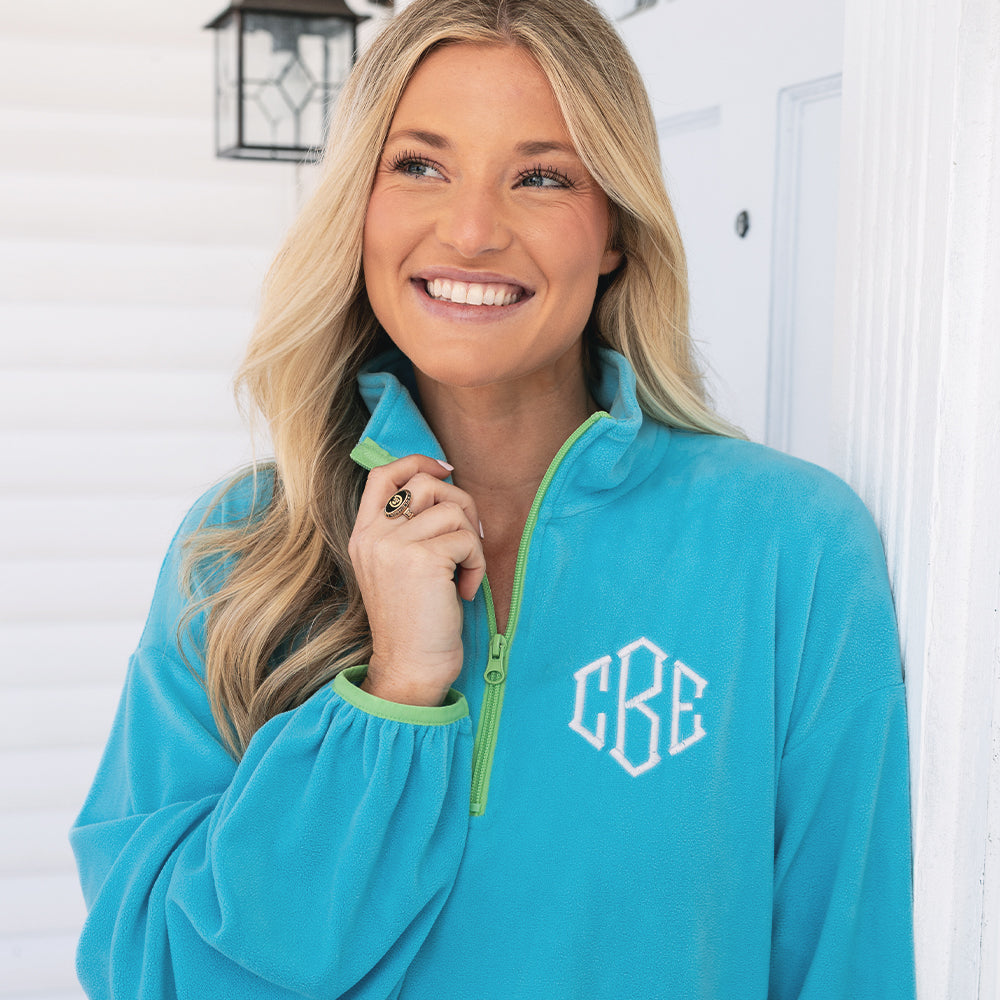 [ashley] girl wearing monogrammed aruba puff sleeve fleece pullover up close