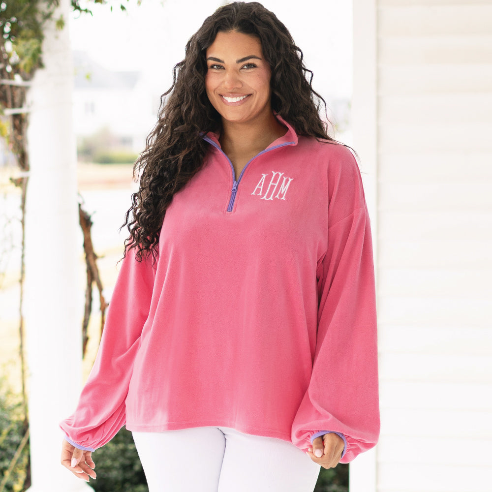 [julia-ann] girl wearing monogrammed puff sleeve fleece pullover in pink up close