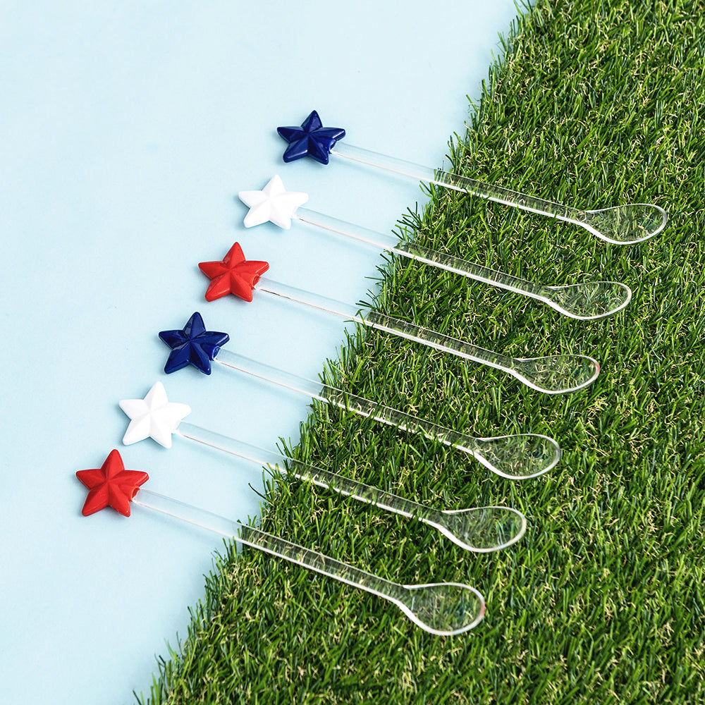 america star spoons on green grass