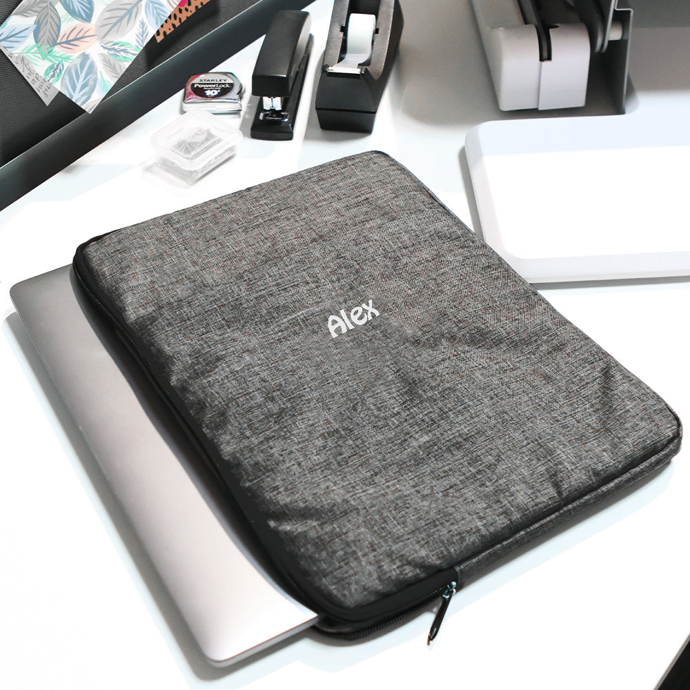 black laptop sleeve flatlay