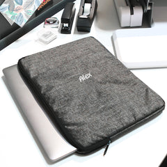 black laptop sleeve flatlay