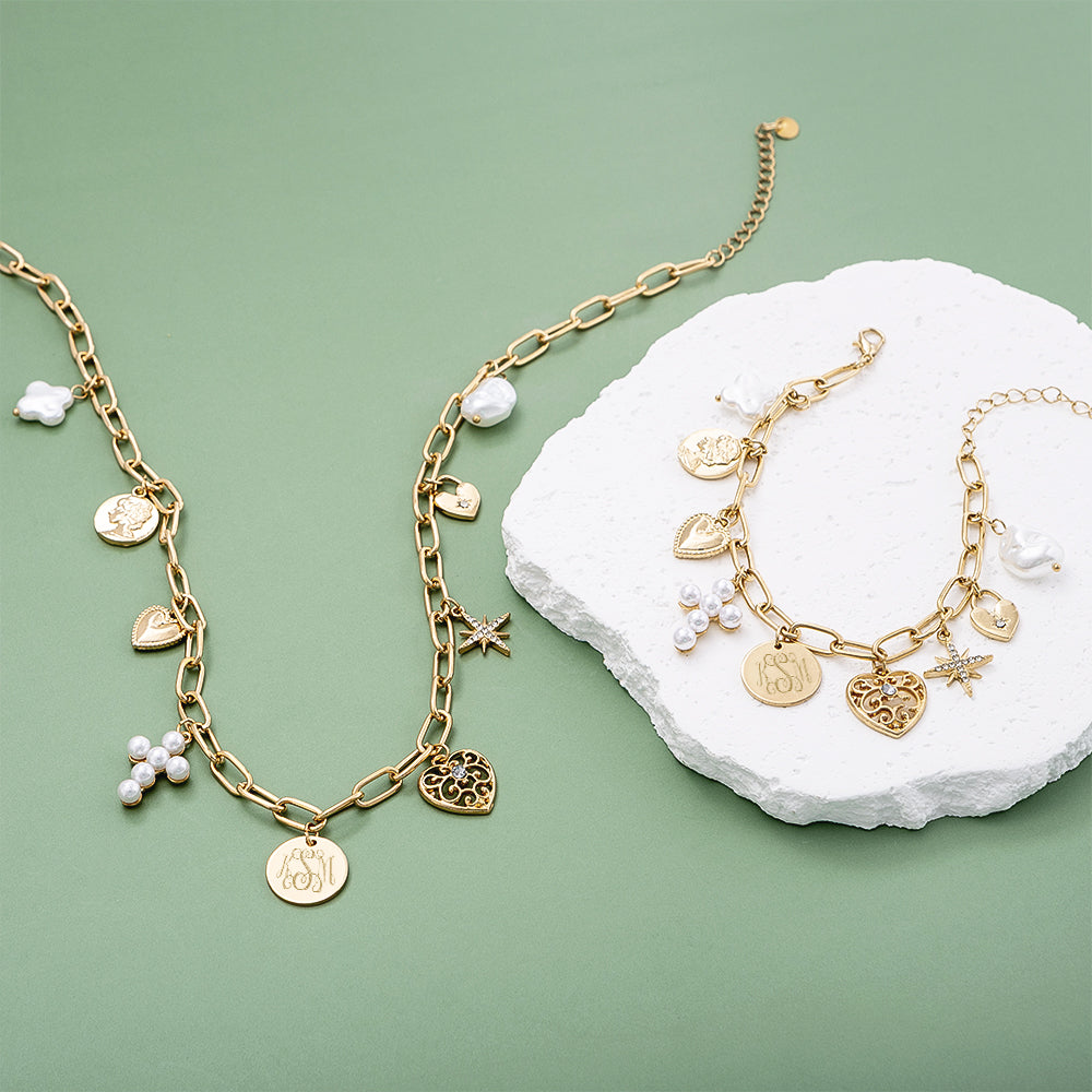 Monogrammed signature charm bracelet and necklace on green