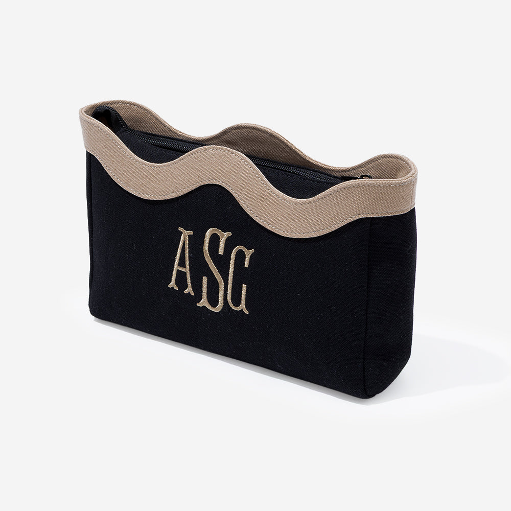 Monogrammed wavy top cosmetic bag in black
