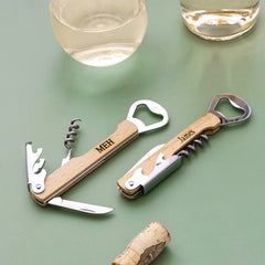 duo wine bottle openers on green background