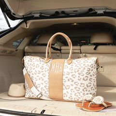 Leopard weekender in neutral leopard in car trunk