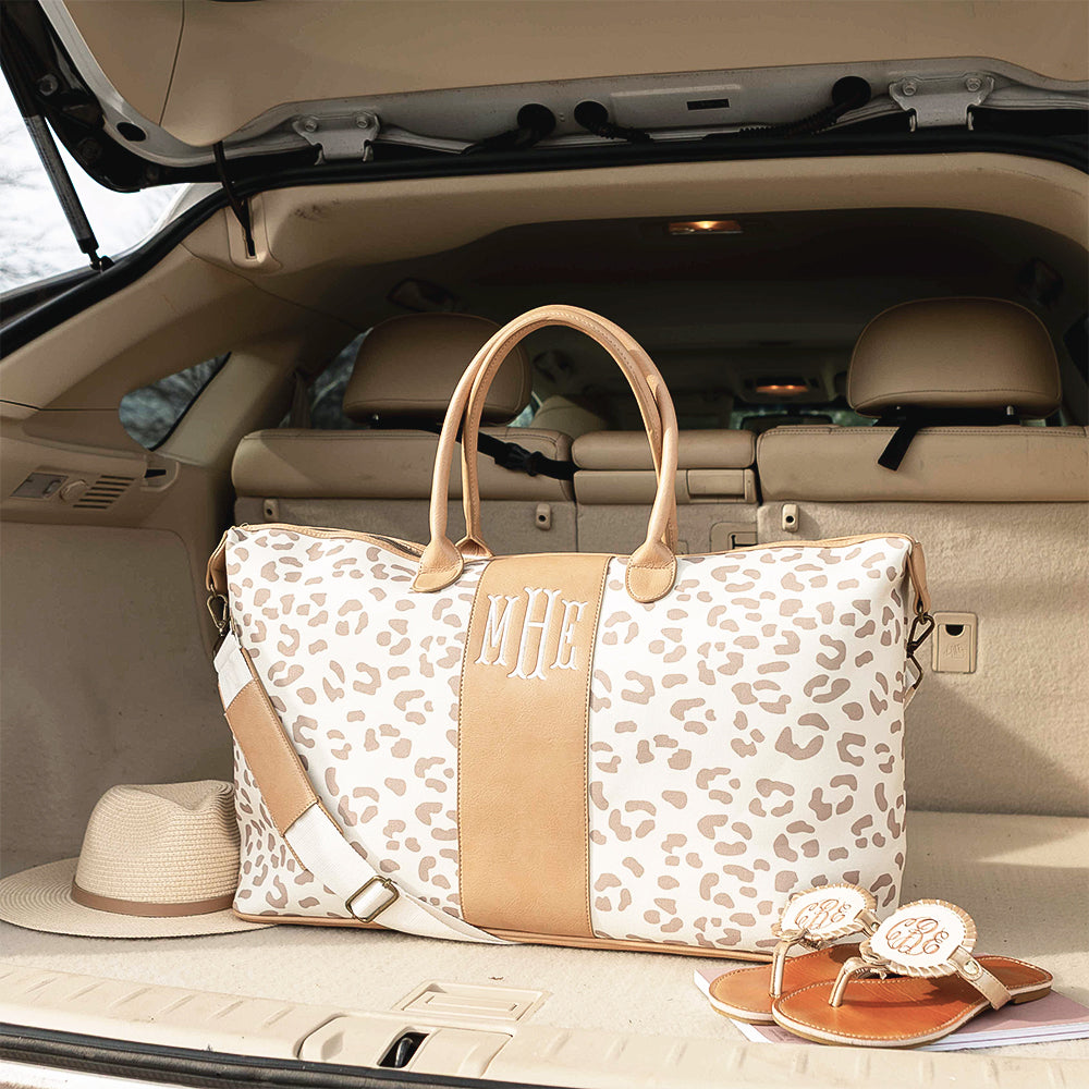 Leopard weekender in neutral leopard in car trunk