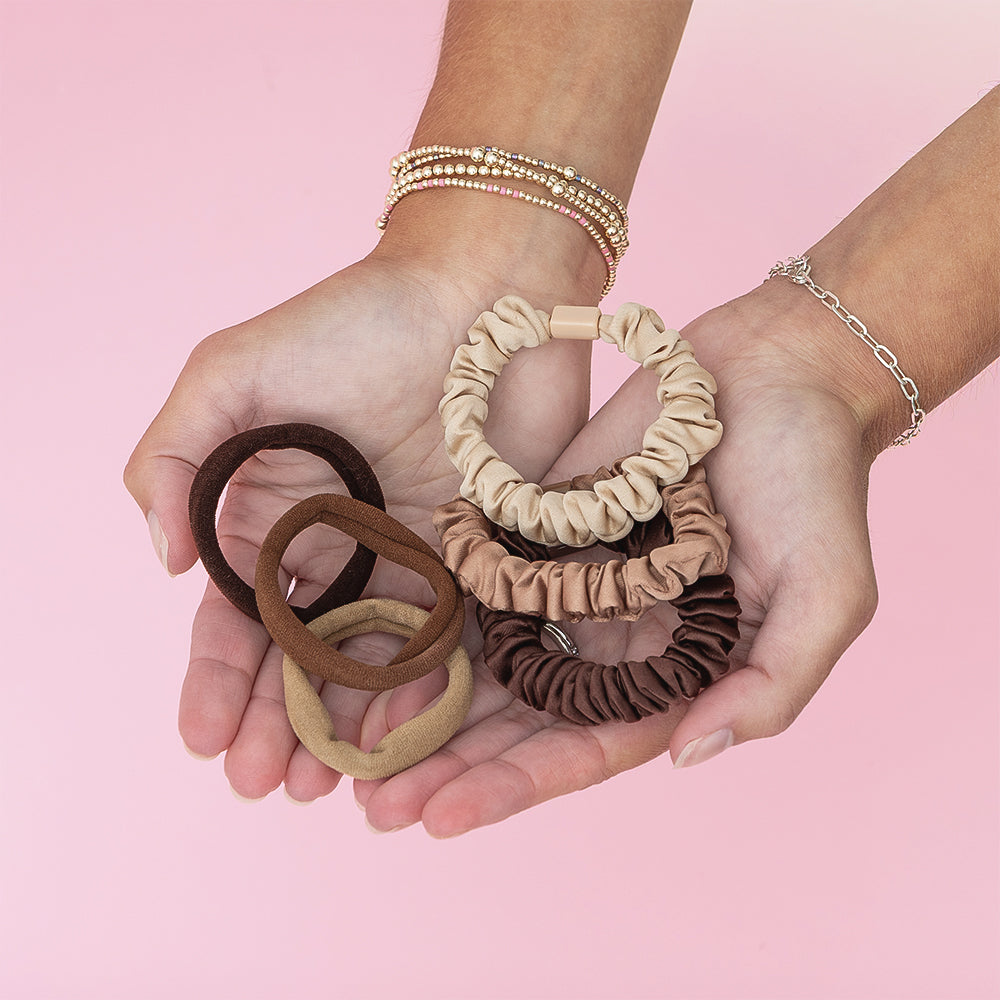 Neutral hair tie set in hands