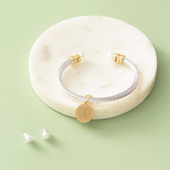 pearl cable bracelet & earring set on marble dish