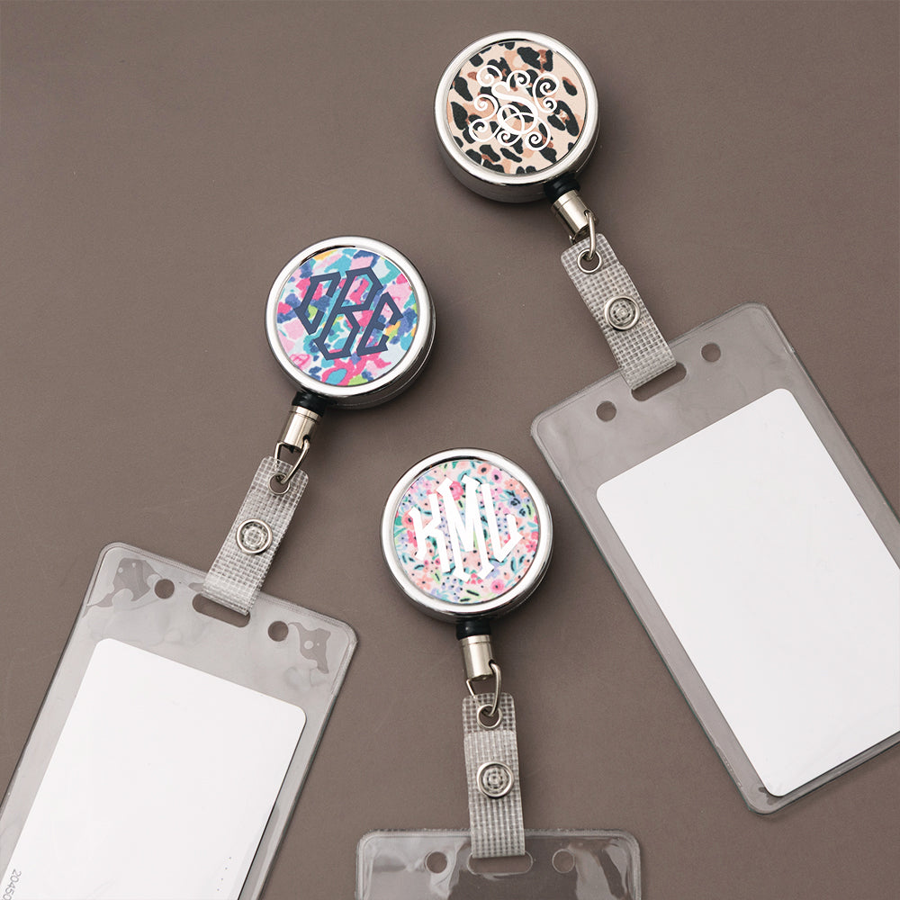 set of 3 badge reels on brown