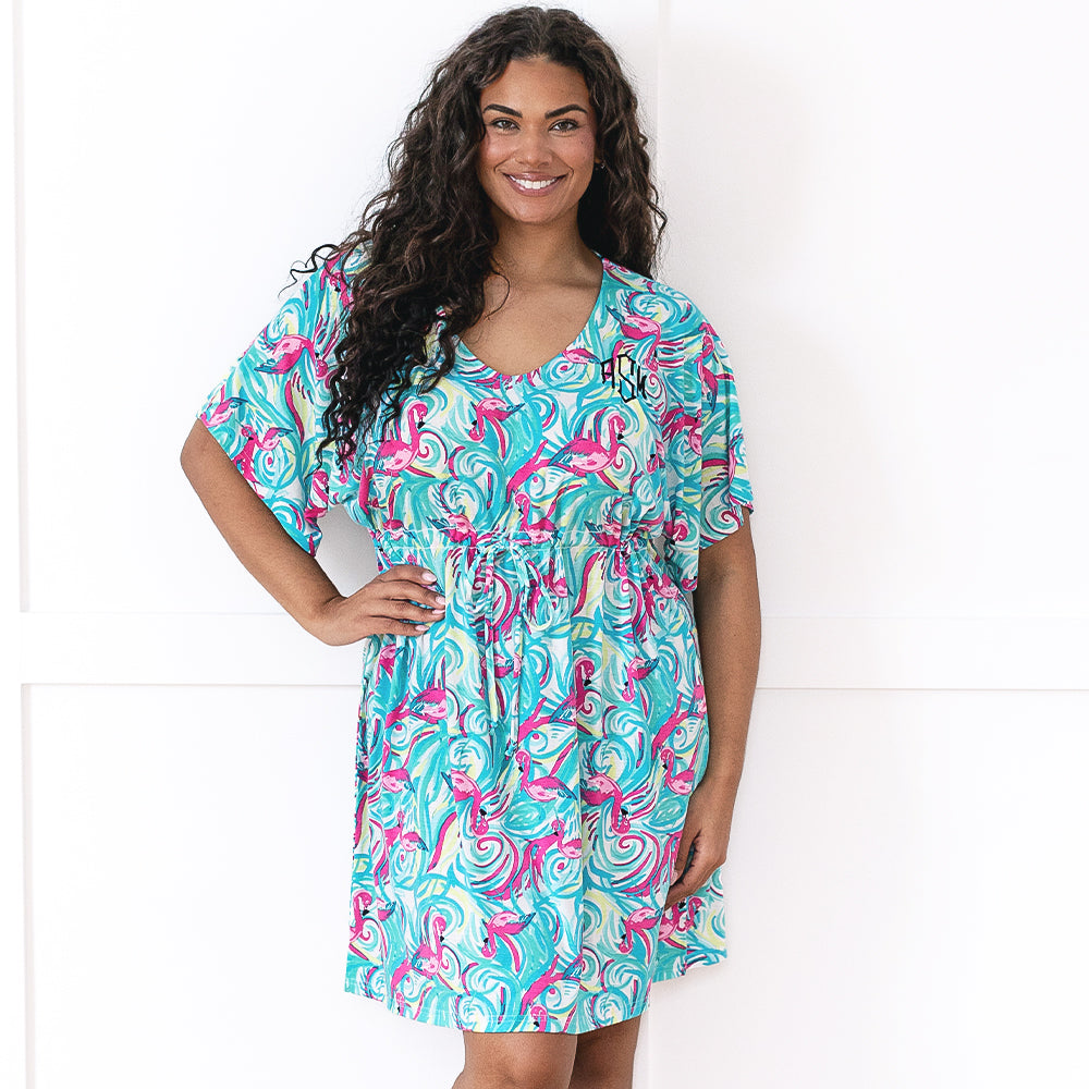 girl wearing personalized cinch waist cover up in flamingo splish splash