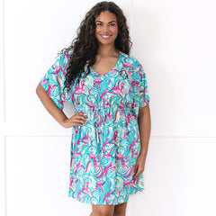 girl wearing personalized cinch waist cover up in flamingo splish splash