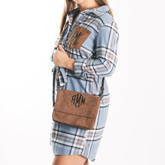 brown monogrammed crossbody over shoulders