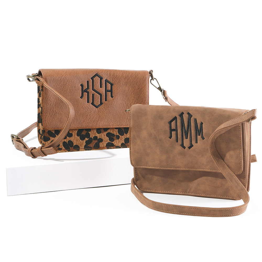 monogrammed crossbodys in leopard and brown in studio
