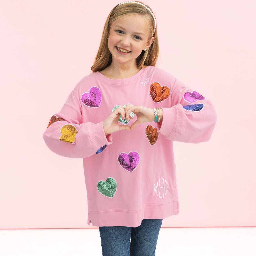 [addie] girl wearing kids monogrammed light pink sequin hearts sweatshirt
