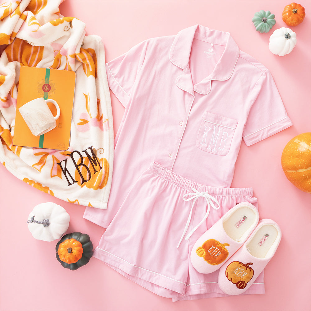 Posh Pumpkins blanket flatlay with sleep set and slippers ootd