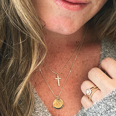 gold monogrammed cross necklace with sweater