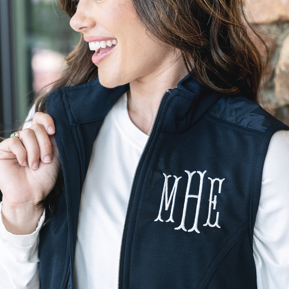 close up of navy monogrammed lightweight vest