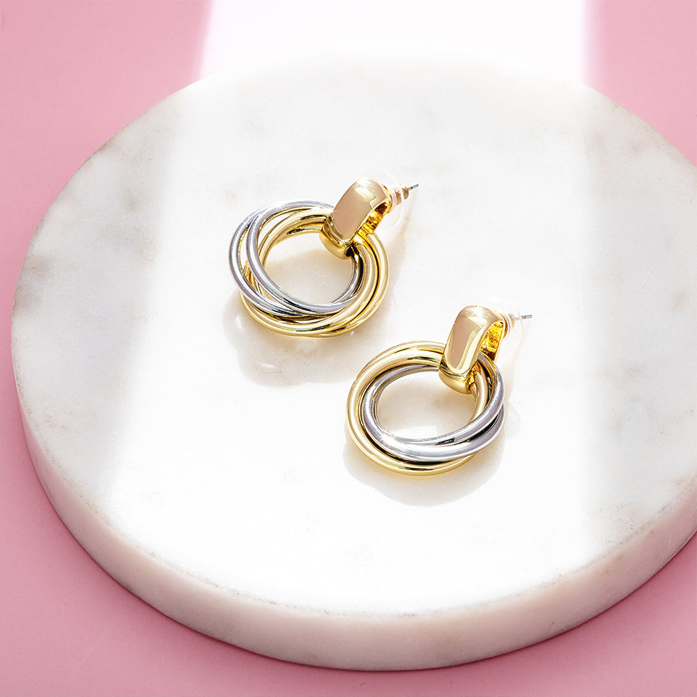 Round Mixed Metal Earrings on marble dish