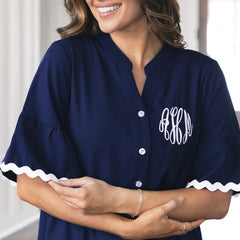close up monogrammed navy ric rac dress
