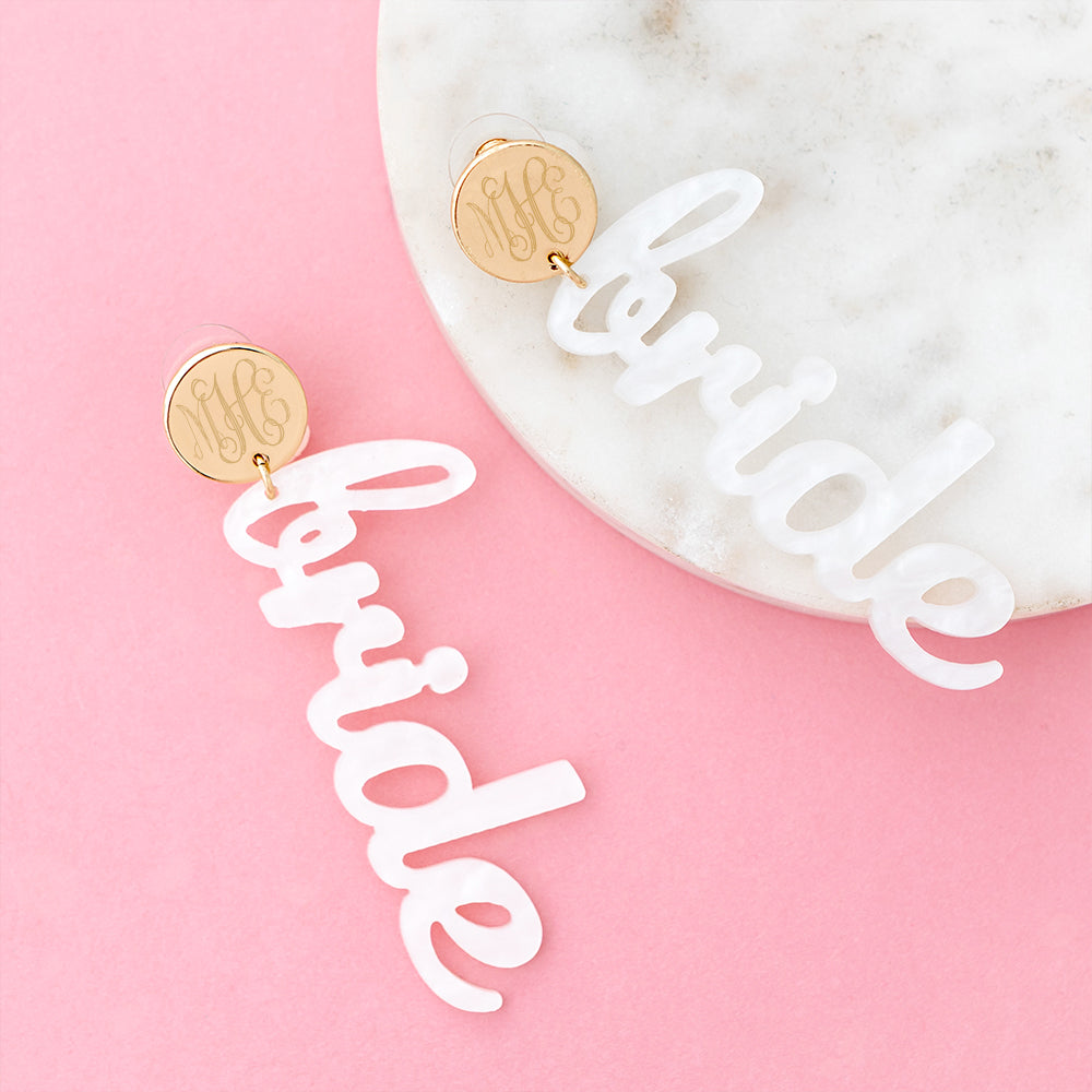 bride earrings on pink
