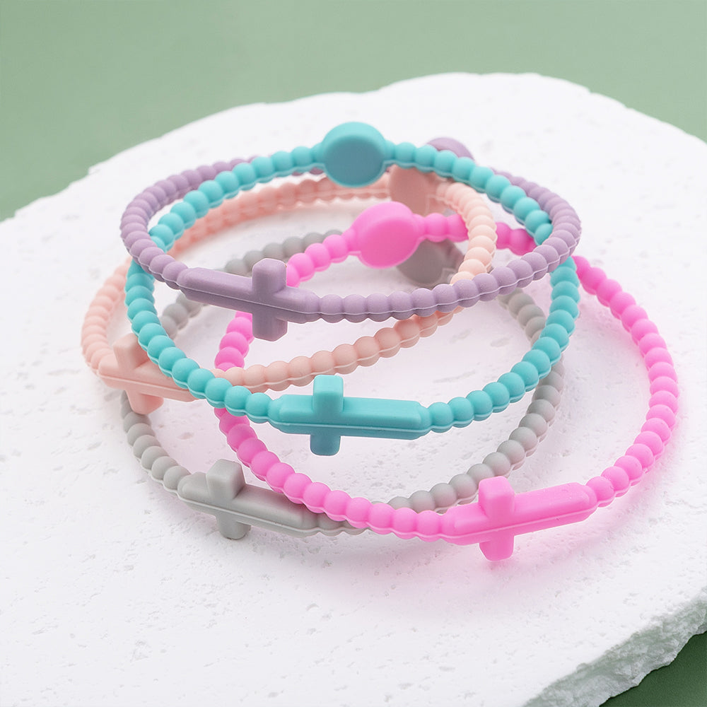 Silicone Cross Bracelet Set on marble