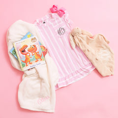 ivory baby blanket with pink and white stripe nightgown