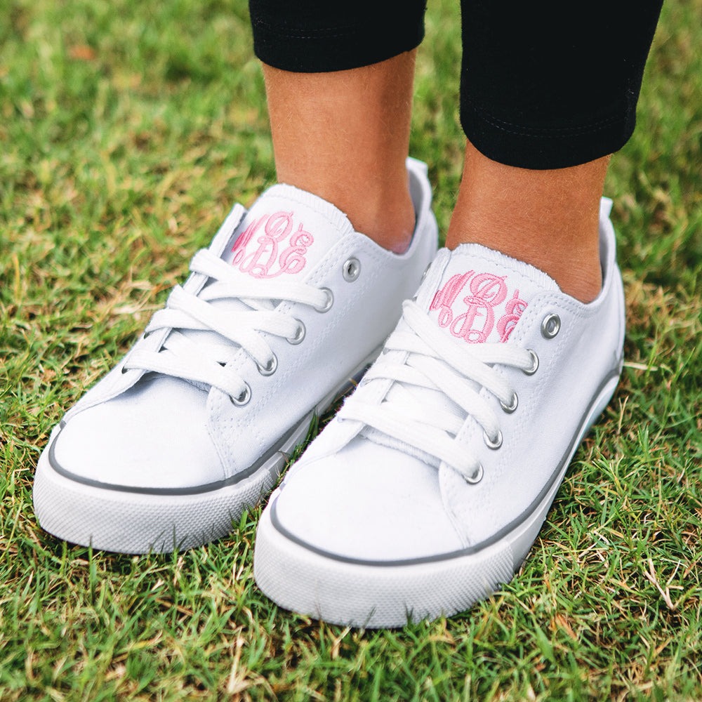 girls white monogrammed sneakers