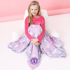 unicorn pink and purple monogrammed blanket over girl