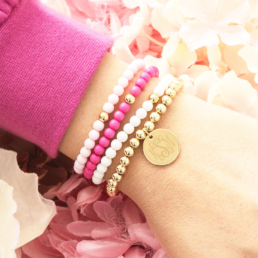 girls pink beaded bracelet stack on arm