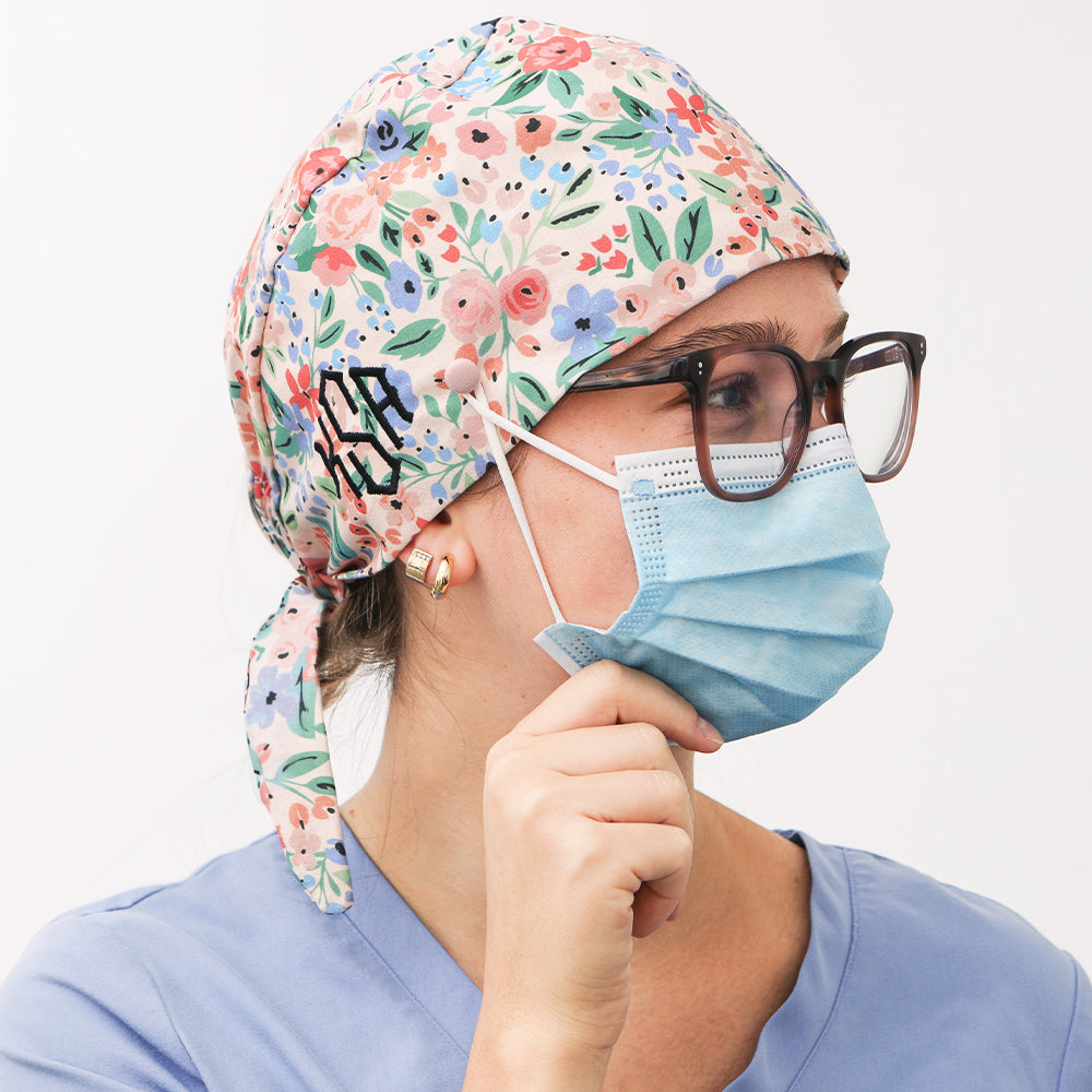 doctor nurse wearing monogrammed coral floral scrub cap