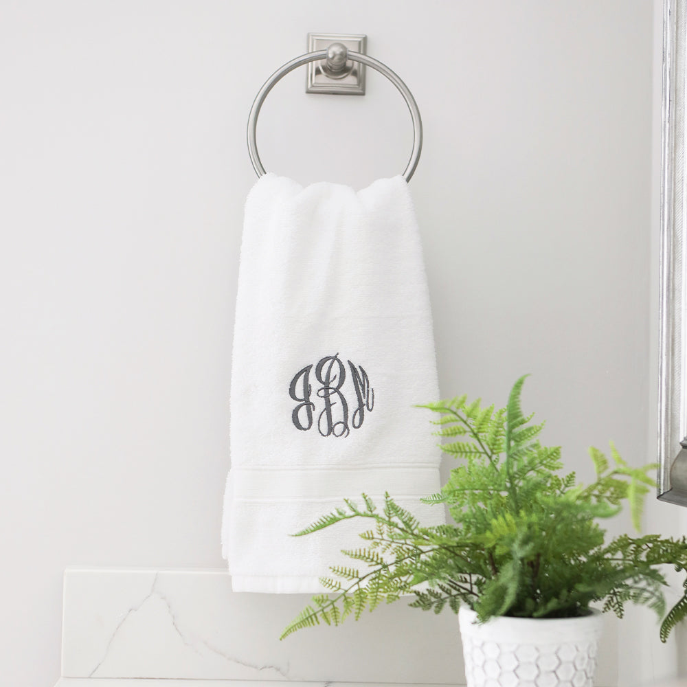 white hand towel hanging up