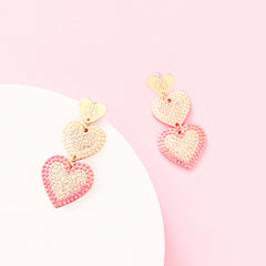 pink heart earrings studio shot