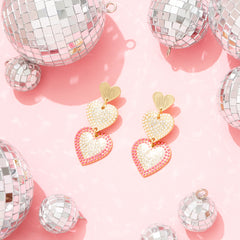 pink heart earrings with disco balls