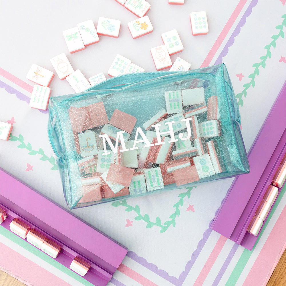 clear blue monogrammed mahjong tile bag on mahjong board