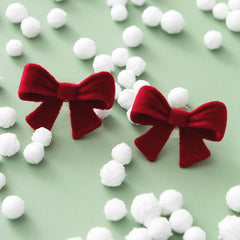 Velvet Bow Stud Earrings on green