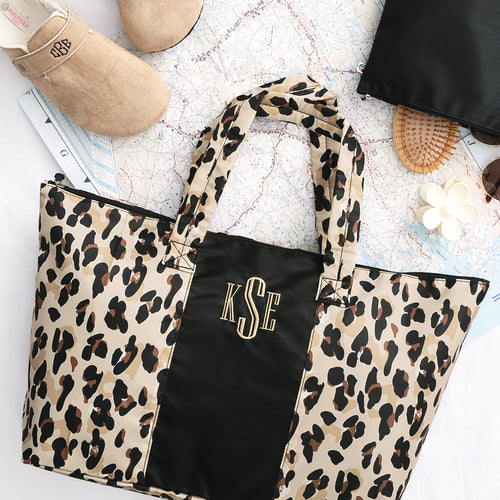 classic cheetah packable duffel on map