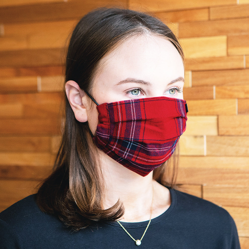 girl wearing holiday plaid face mask