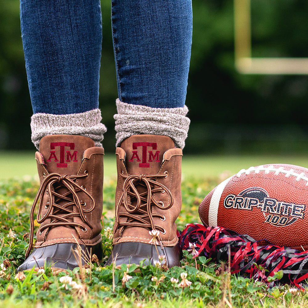 texas a&m duck boots on football field