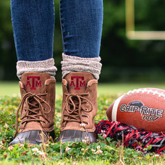 texas a&m duck boots on football field