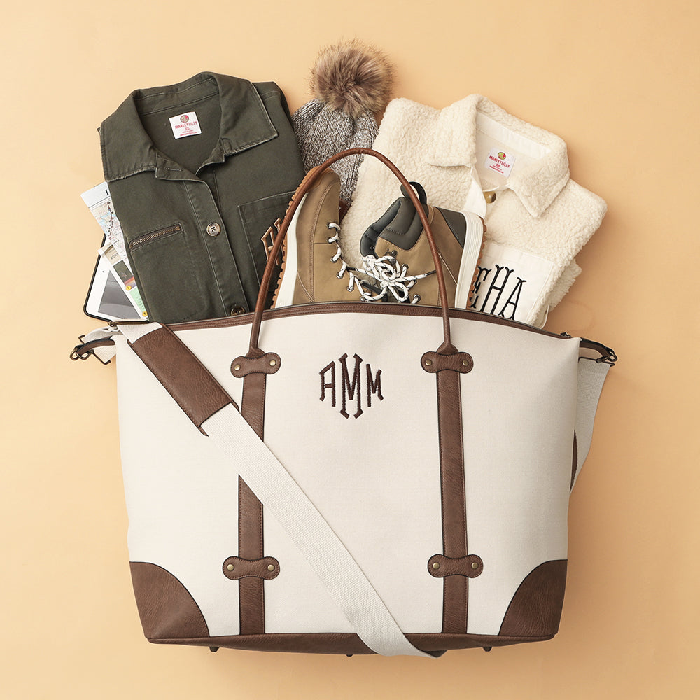 ivory vintage weekender flatlay - 2024