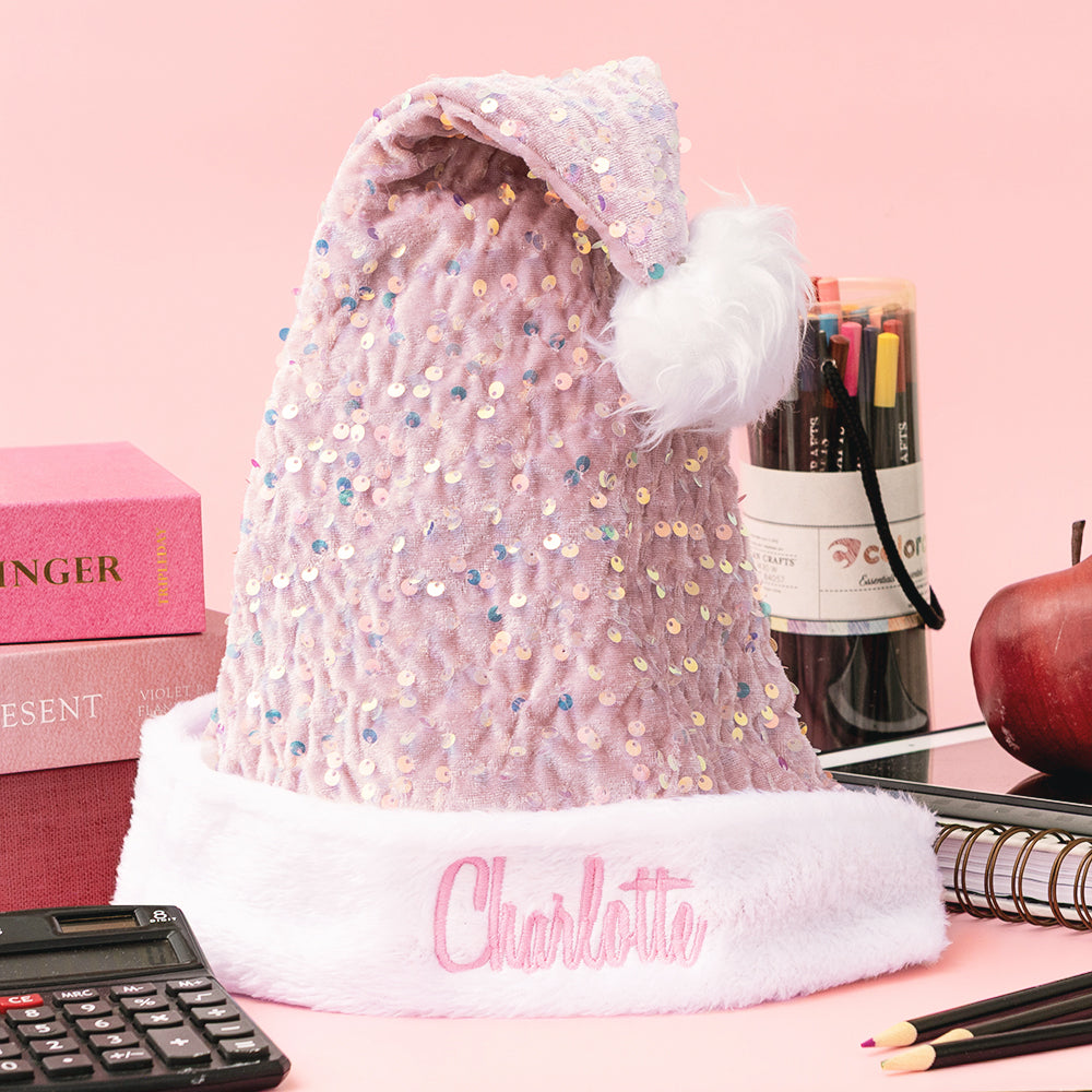 pink personalized santa hat on teachers desk