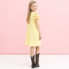 back of girl wearing soft yellow personalized girls flutter sleeve dress