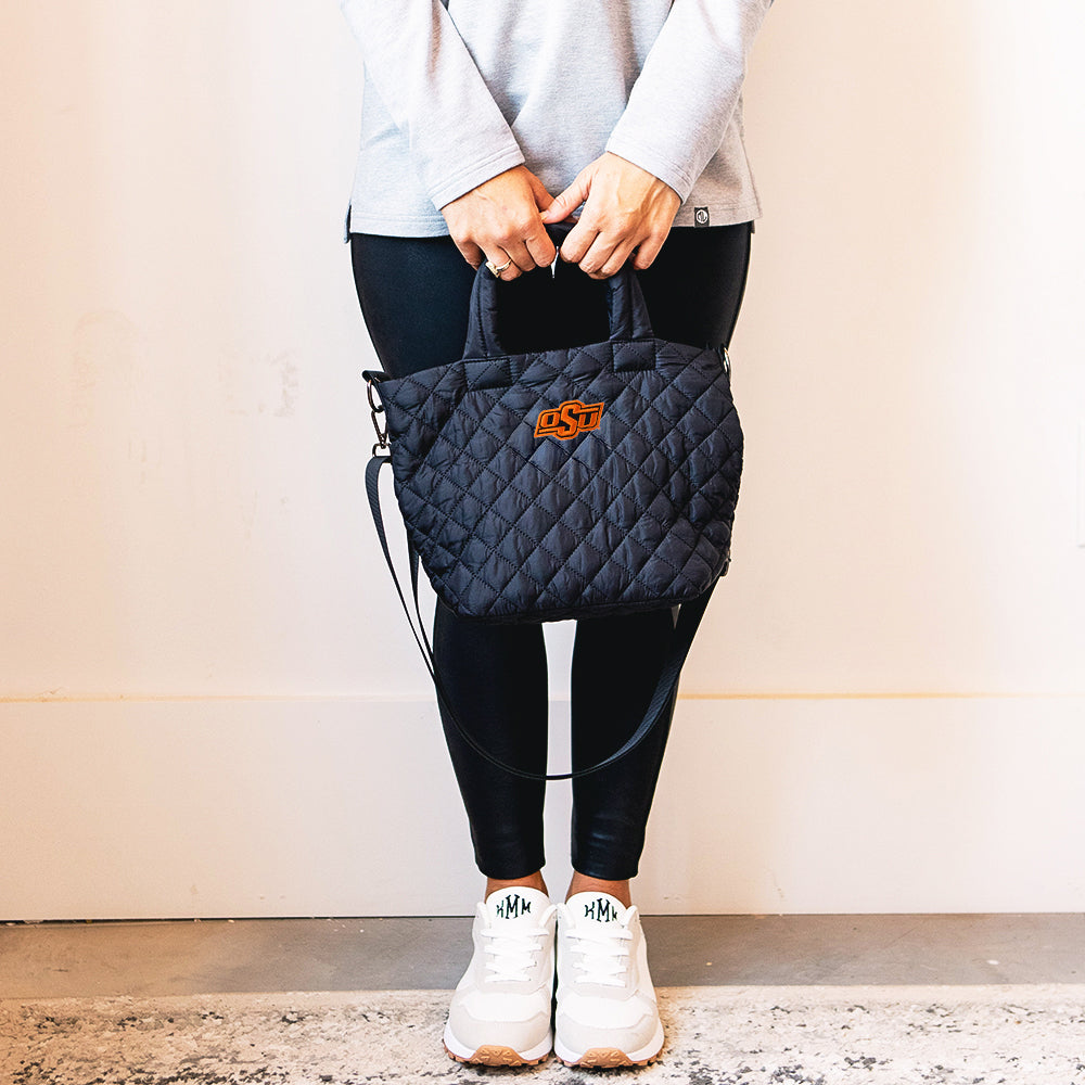 Girl holding OSU Diamond Quilted Crossbody