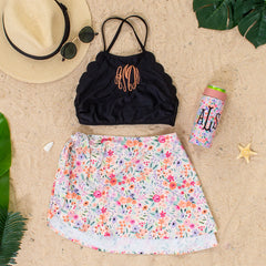 flatlay of scalloped high neck bikini top - black