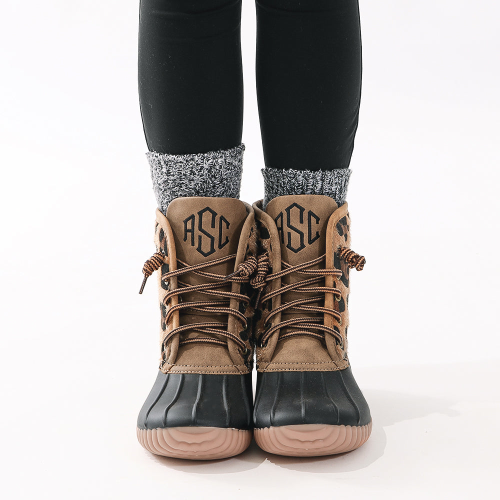close up of leopard spots duck boots