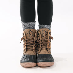 close up of leopard spots duck boots