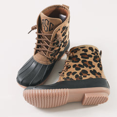 studio shot of leopard spots duck boots